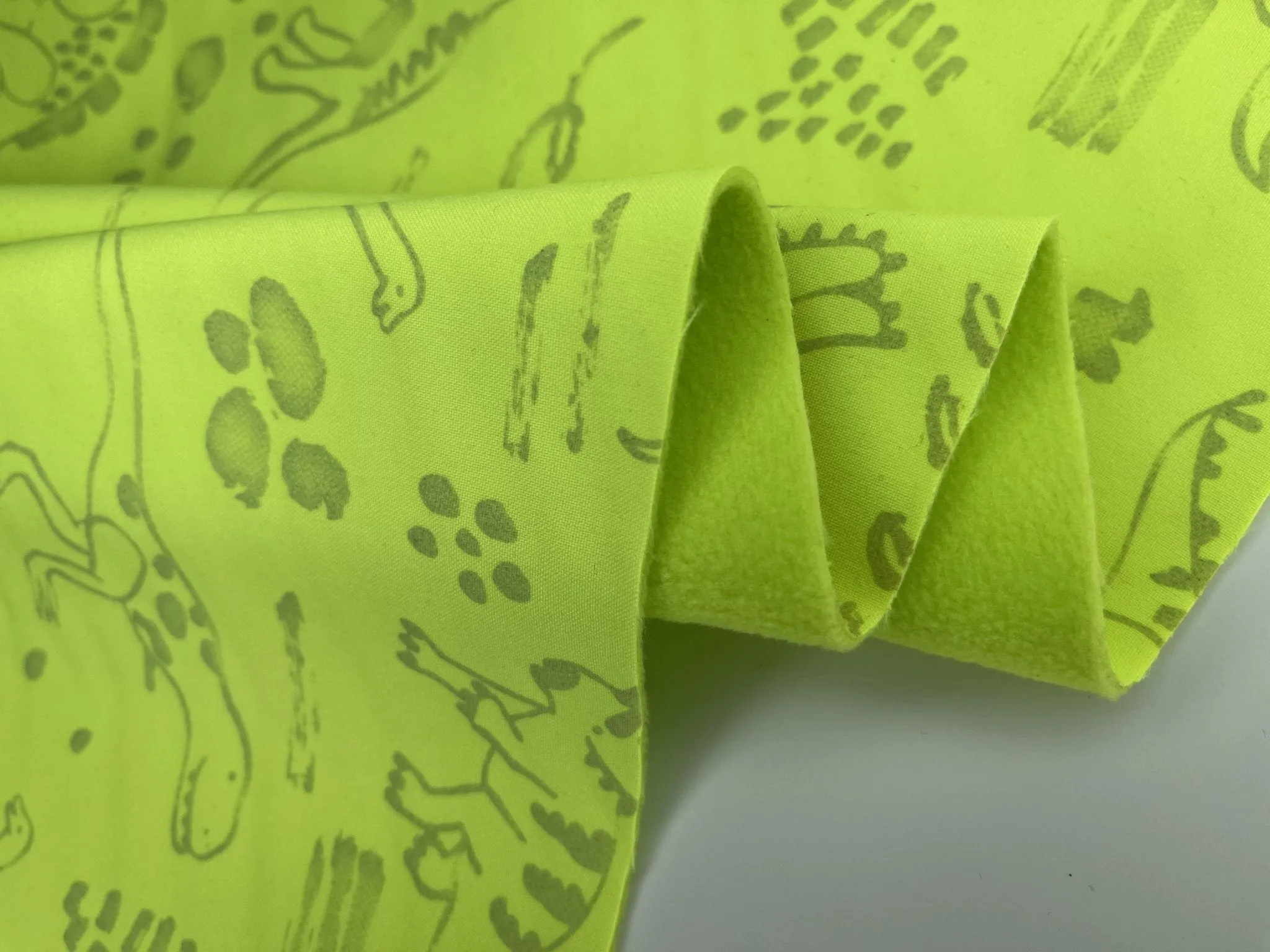 Softshell Neon Glow in the Dark Dinosaur Print  Fabric